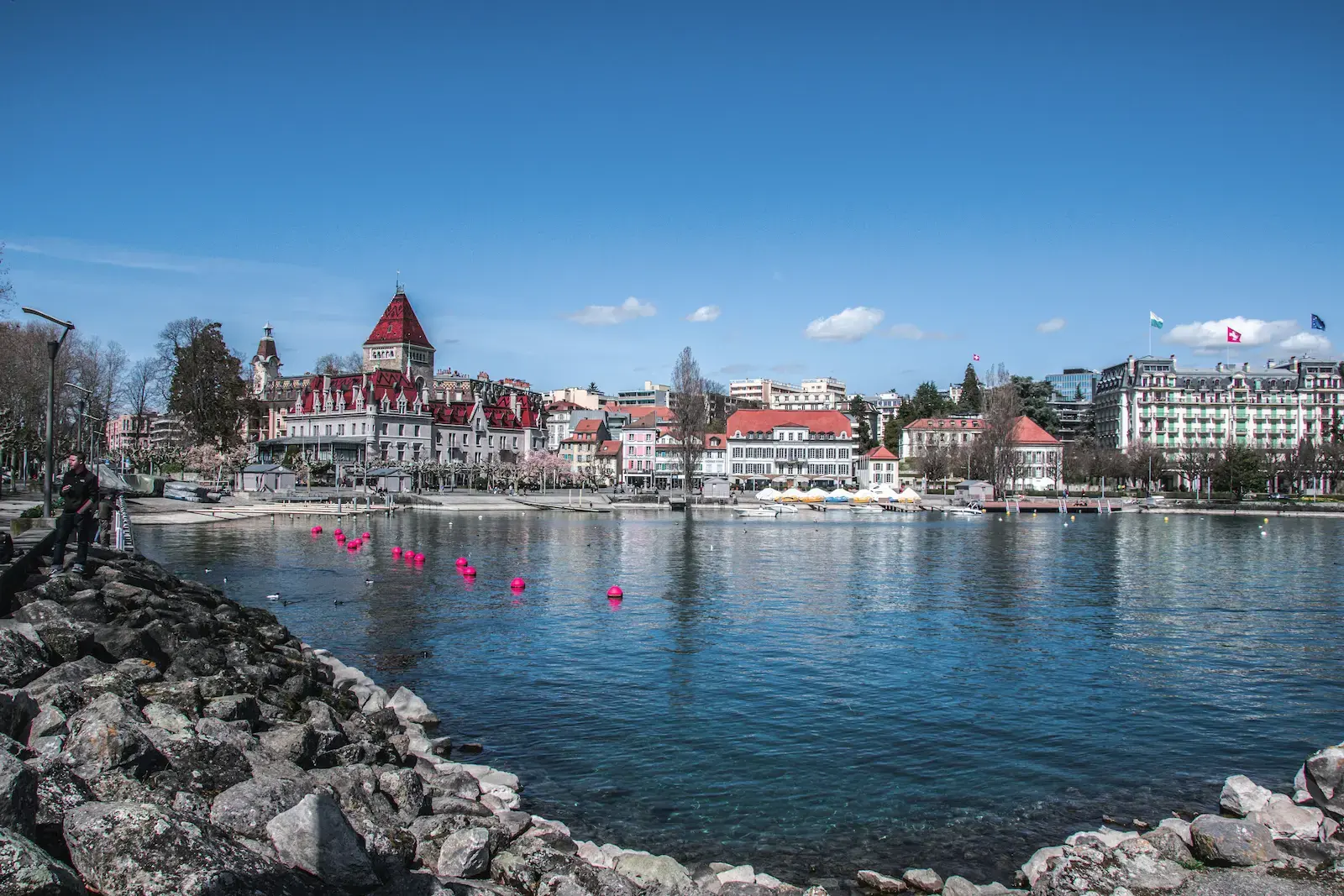 Panoramic View Of Ouchy Promenade And Chateau Douchy On The Shores Of Lake Geneva In Lausanne